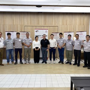 CPM and IDAH team members celebrate the announcement in Taiwan